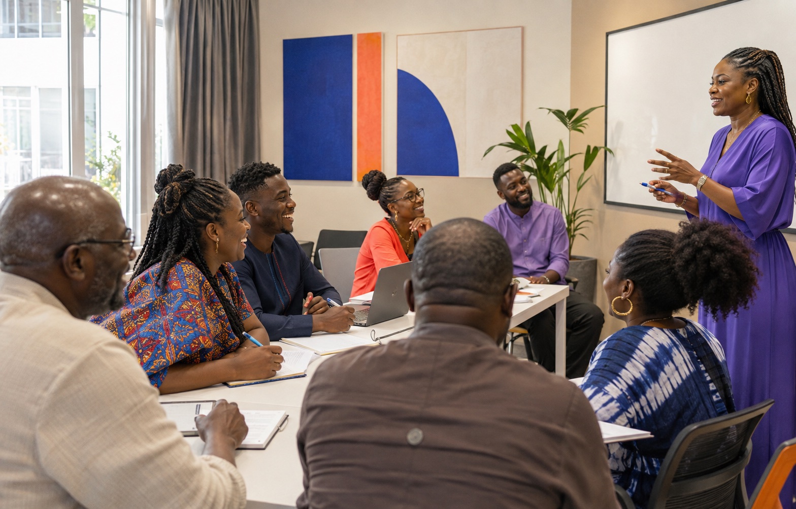 Adult learners enjoying an energetic French workshop in Lagos